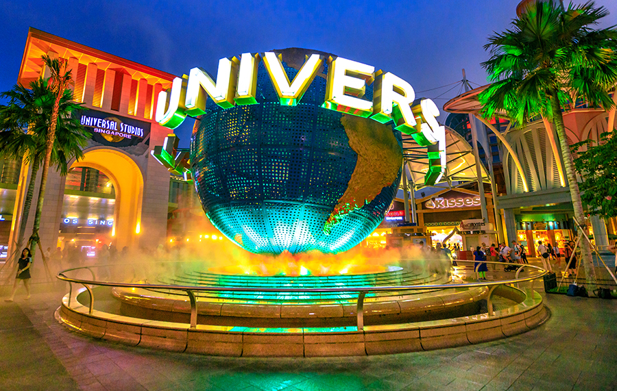 Universal Studios globe lit up at night